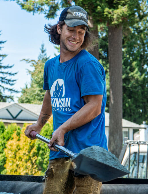 Langley Landscaper Shoveling and Cleaning Up Yard