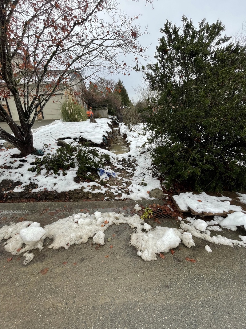 the snow filled trench from earlier showing signs of the snow and ice melting